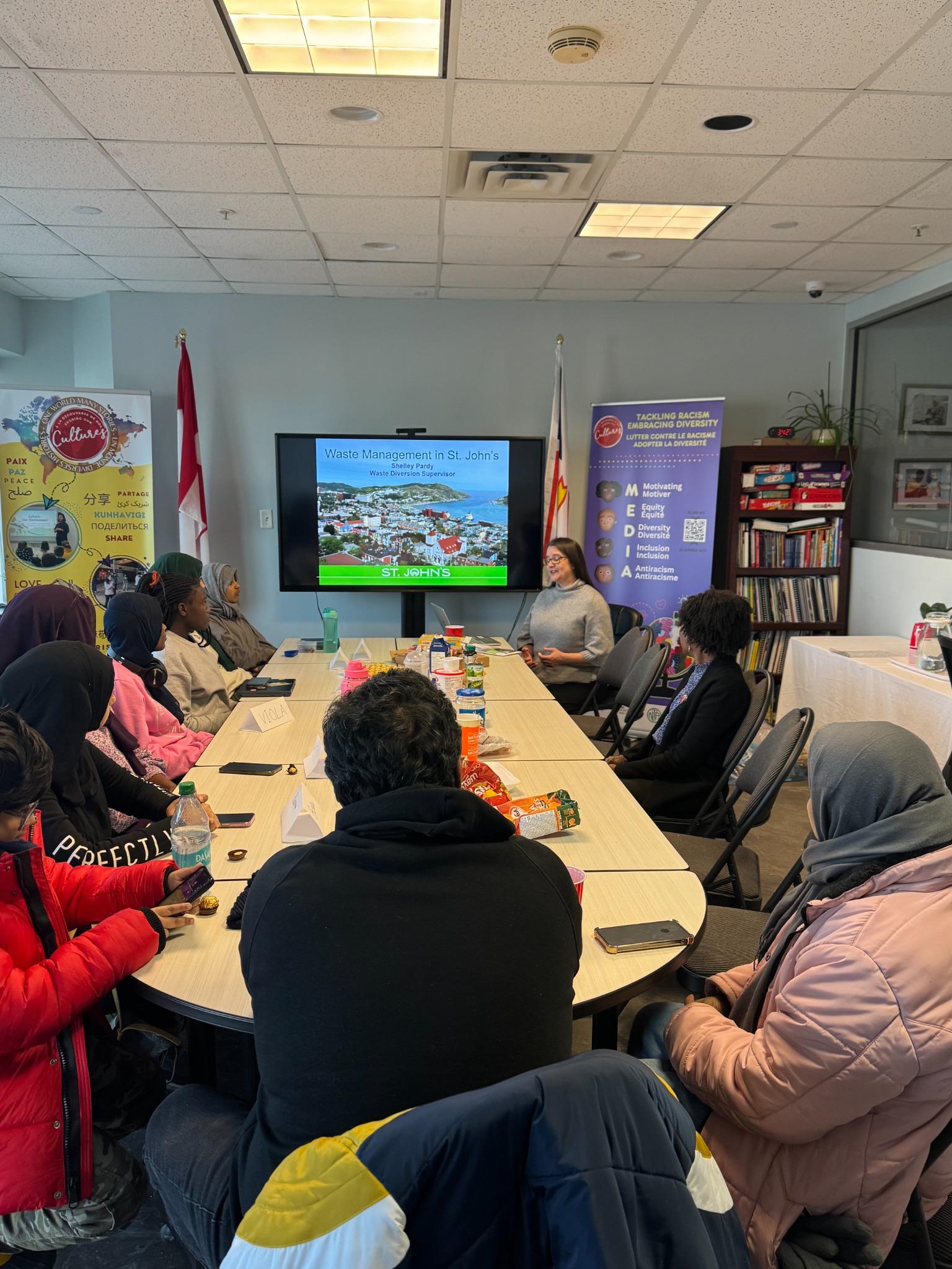 Facilitator presenting on waste management in St. John's